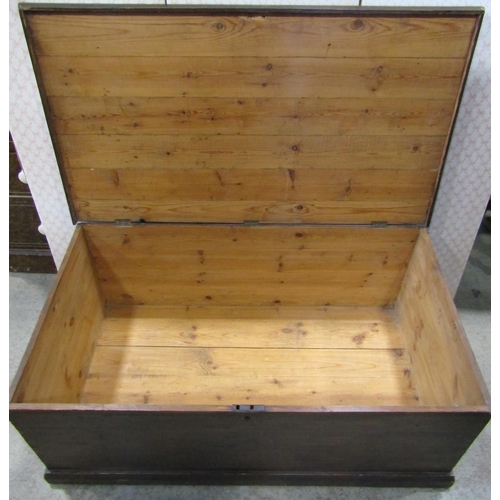 1368 - A large stained pine blanket chest with hinged lid and exposed dovetail construction 120 cm wide x 6... 