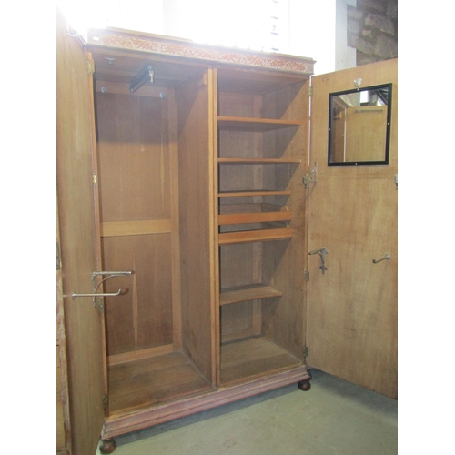 1400 - An early 20th century limed/fumed oak bedroom suite comprising two sectional wardrobe enclosed by a ... 