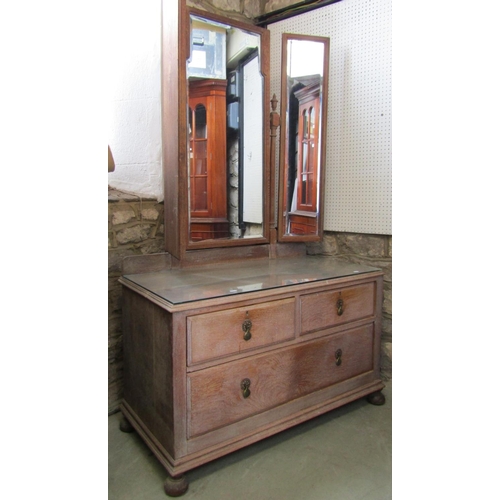 1400 - An early 20th century limed/fumed oak bedroom suite comprising two sectional wardrobe enclosed by a ... 