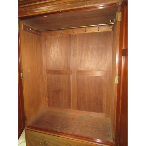 1406 - An inlaid Edwardian mahogany wardrobe with satinwood crossbanding, boxwood and ebony stringing, encl... 