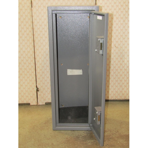 1425 - A small steel gun cabinet enclosed by a single door with two locks, 30cm wide x 22cm deep x 82cm hig... 