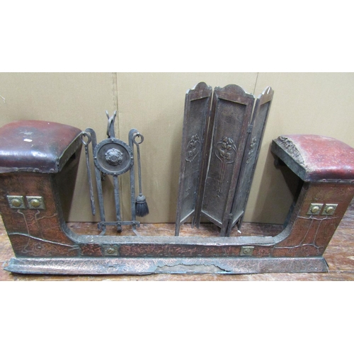 1616 - An arts and crafts hammered copper club fender with further applied brass detail, the corner seats u... 