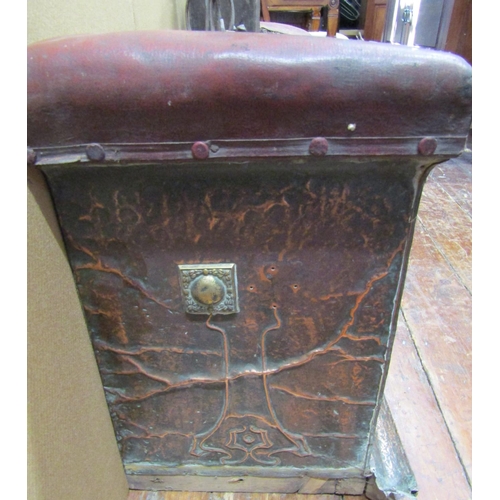 1616 - An arts and crafts hammered copper club fender with further applied brass detail, the corner seats u... 