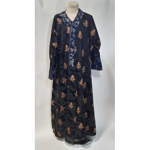 625 - Oriental vintage kimono gown made of patterned black silk embroidered with goldwork characters and l... 