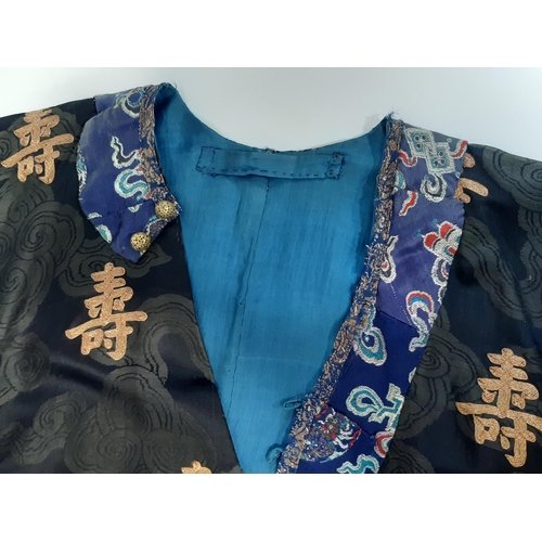 625 - Oriental vintage kimono gown made of patterned black silk embroidered with goldwork characters and l... 