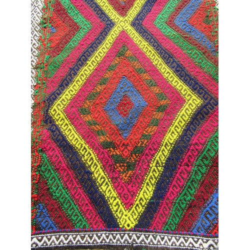 1782 - An old Sunni flat weave runner with brightly coloured panels, 320cm x 82cm approx