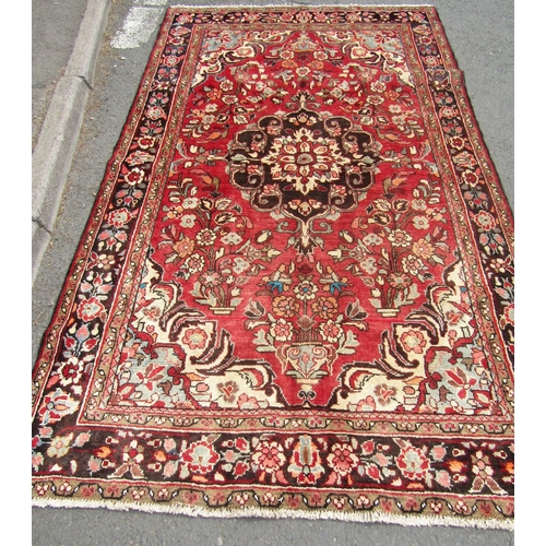 1786 - North west Persian Borchalue carpet with a central medallion and an all over  floral pattern on a pi... 