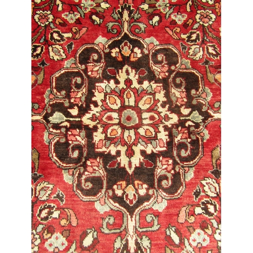 1786 - North west Persian Borchalue carpet with a central medallion and an all over  floral pattern on a pi... 