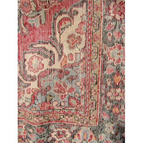 1786 - North west Persian Borchalue carpet with a central medallion and an all over  floral pattern on a pi... 