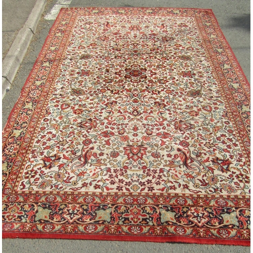 1787 - A Persian design carpet with an all over floral pattern and running floral borders, 300cm x 200cm ap... 