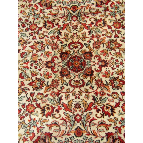 1787 - A Persian design carpet with an all over floral pattern and running floral borders, 300cm x 200cm ap... 