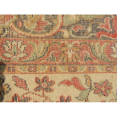 1787 - A Persian design carpet with an all over floral pattern and running floral borders, 300cm x 200cm ap... 