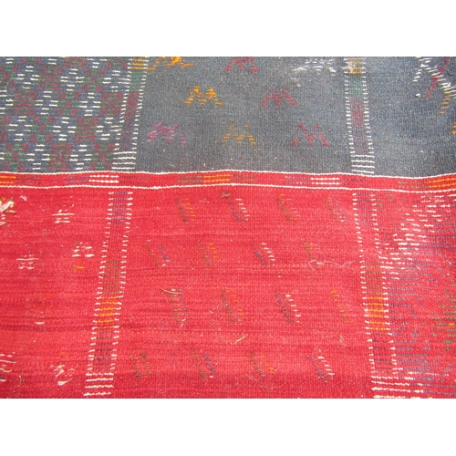 1790 - A Dhurrie flat weave carpet with a single side square pattern with random motifs, 250cm 160cm approx