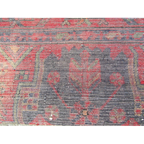 1794 - North west Persian Nahawand rug with a central elongated stepped medallion on a predominantly red gr... 