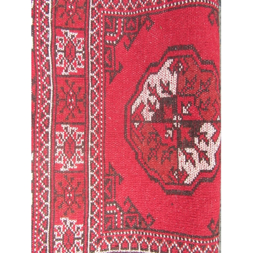 1799 - North East Persian Turkoman runner with central row of elephant foot gul on red ground  295cm x 70cm... 