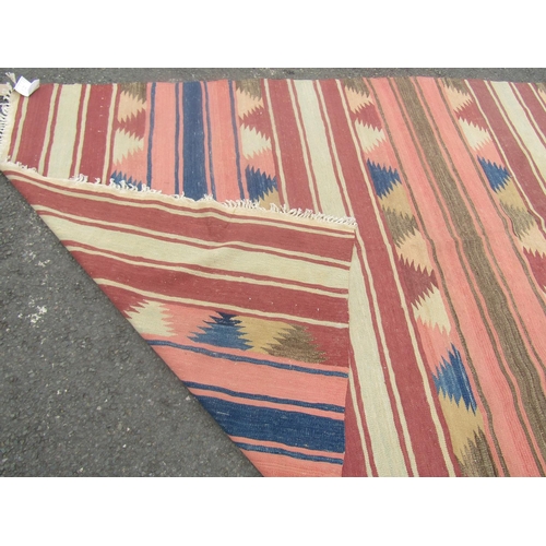 1800 - A large flat weave  Dhurrie carpet with repeating multi coloured horizontal stripe, 470cm x 160cm ap... 