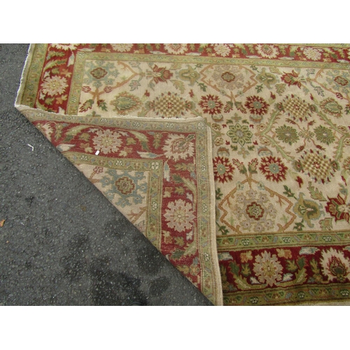 1809 - A Ziegler design carpet with floral palmettes to a fawn ground,230cm x 170cm approx