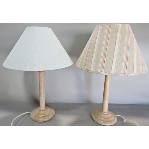 694 - A collection of table lamps, two brass and glass column, a pair of wooden turned, a floral ginger ja... 