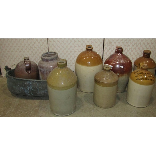 1134 - A collection of 19th century stoneware flagons to include a two gallon salt glazed example stamped V... 