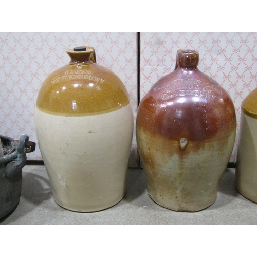 1134 - A collection of 19th century stoneware flagons to include a two gallon salt glazed example stamped V... 