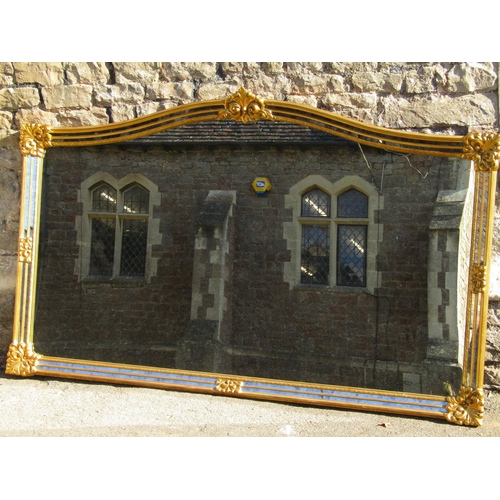 1476 - A large contemporary antique style wall mirror with rectangular gilt arched frame, with foliate deta... 