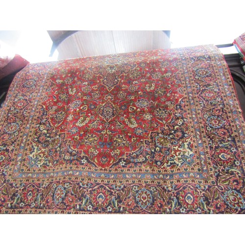 1802 - Central Persian Kashan carpet  with a central floral medallion and an all over floral pattern on a r... 