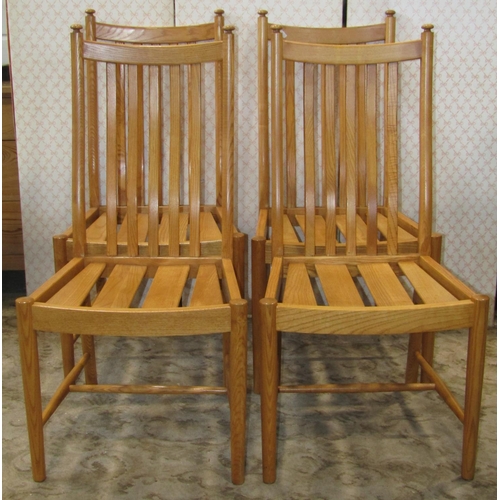 1388 - An Ercol light elm refectory table, the rectangular top with moulded outline raised on waisted suppo... 