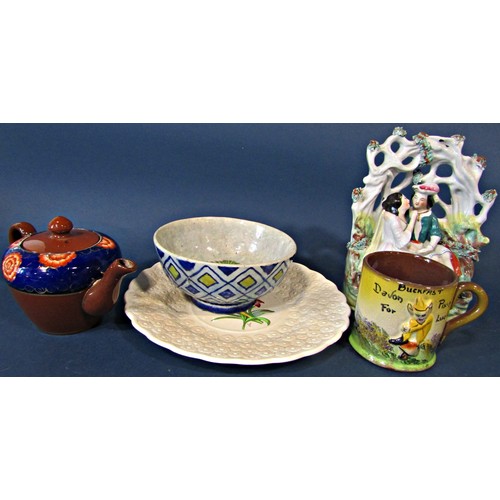 97a - A collection of miscellaneous ceramics to include a Staffordshire arbour group of a romantic couple,... 