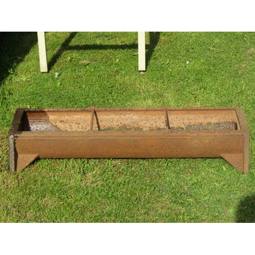1042a - A vintage cast iron pig feeding trough of rectangular form with two run divisions, 90cm long x 38cm ... 