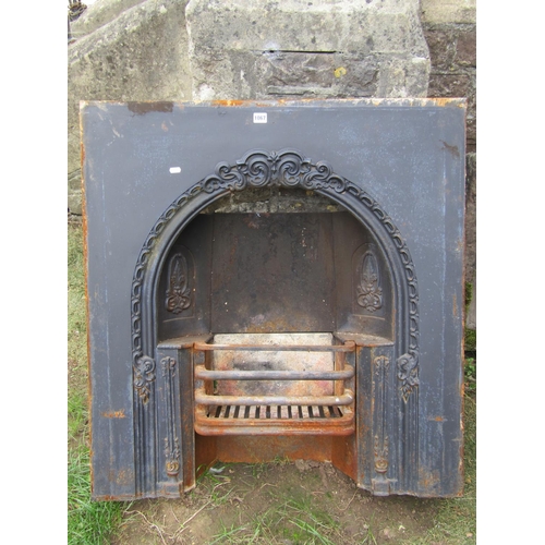 1067 - A reclaimed cast iron fire insert with decorative floral relief detail, 91cm wide x 97cm high