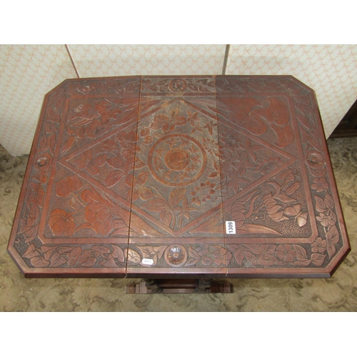 1309 - A late Victorian/Edwardian walnut drop leaf occasional table with decorative carved foliate detail t... 