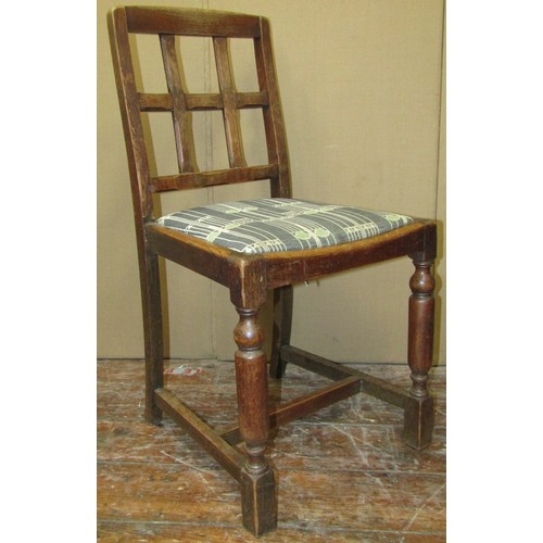 1622a - A set of four arts and crafts style oak low back dining chairs with chamfered splats over drop in pa... 