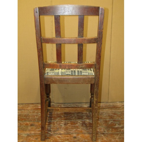 1622a - A set of four arts and crafts style oak low back dining chairs with chamfered splats over drop in pa... 