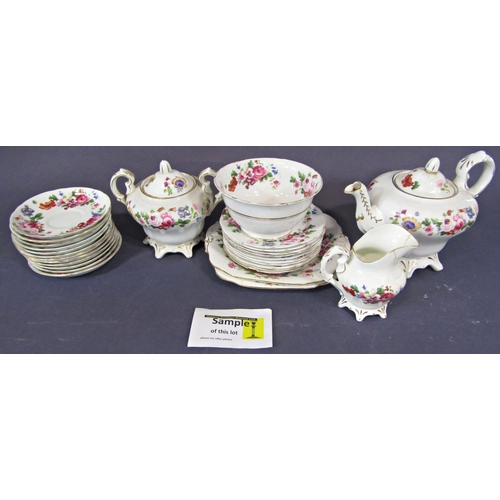 1003 - A collection of tea wares with printed floral detail comprising teapot, covered sucrier, milk jug, s... 