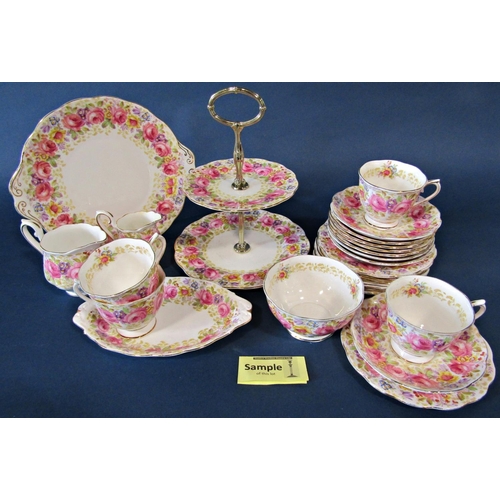 1015 - A Royal Albert Serena tea service for twelve with additional shaped dish and two tier cake stand, al... 