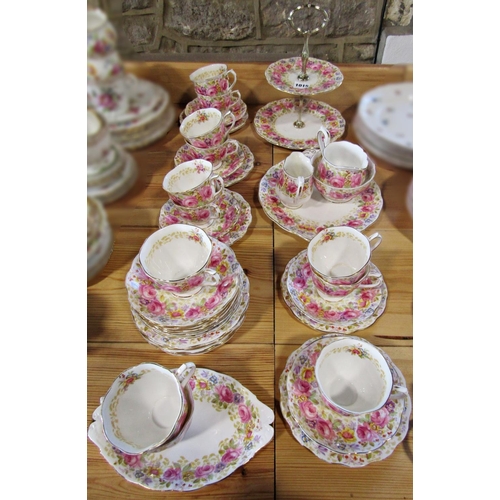 1015 - A Royal Albert Serena tea service for twelve with additional shaped dish and two tier cake stand, al... 