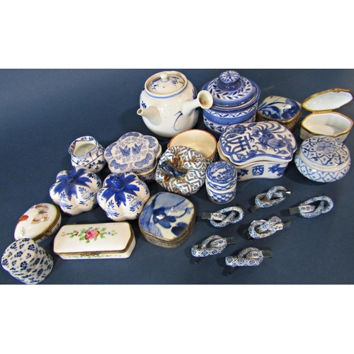 1023 - A collection of small Chinese and other porcelain boxes in varying shapes, small open vase, etc