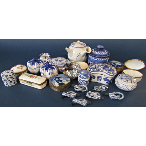 1023 - A collection of small Chinese and other porcelain boxes in varying shapes, small open vase, etc