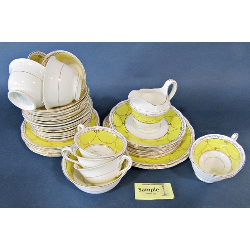 1028 - A Grosvenor china yellow and gilt ground tea service, examples of Phoenix ware including a teapot, m... 