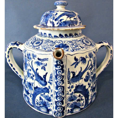 1033 - A large antique English Delft posset pot, late 17th century with loop handles and central spout, tog... 