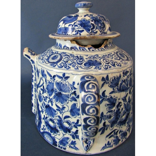 1033 - A large antique English Delft posset pot, late 17th century with loop handles and central spout, tog... 