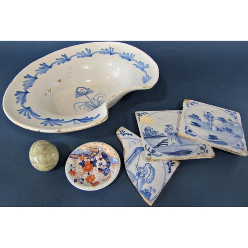 1049 - A blue and white hand painted barbers dish, two delft tiles, etc