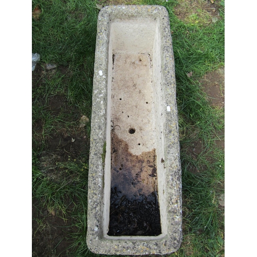 2041 - A weathered cast composition stone flower trough of rectangular form with repeating harvesting cheru... 