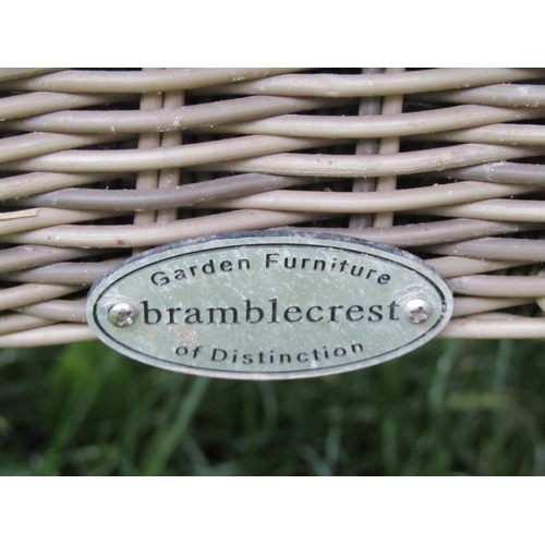 2068 - A Bramblecrest rattan garden terrace table of rectangular form with rounded corners and plate glass ... 