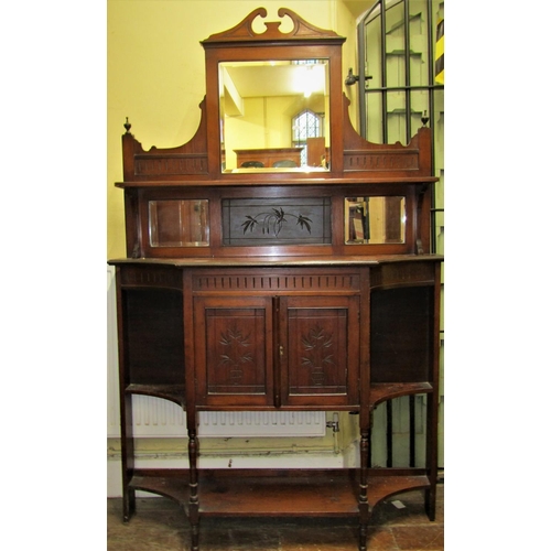 2650 - A Victorian mahogany chiffonier, the base enclosed by a central cupboard flanked by open shelves, wi... 