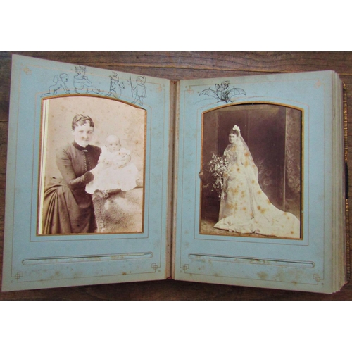 141 - A late 19th early 20th century photograph album embellished with pen and ink sketches after Richard ... 