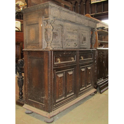 2265 - An antique old English style oak court cupboard enclosed by an arrangement of cupboards and drawers ... 