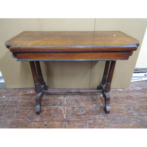 2685 - A Victorian walnut and burr walnut foldover top card table, raised on a stretcher base, supported by... 