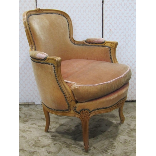 2347 - A salon chair with shaped carved and moulded beechwood frame enclosing an upholstered seat and back ... 