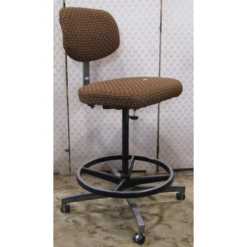 2379 - A Tan-sad Nova vintage swivel office chair with upholstered seat and back raised on a tubular suppor... 